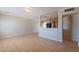 Inviting living room with an open layout, tile flooring, and view into the kitchen at 1811 W Roma Ave, Phoenix, AZ 85015
