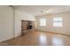 Cozy living room featuring a brick fireplace and tile flooring, perfect for relaxing at 1811 W Roma Ave, Phoenix, AZ 85015