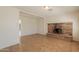 Spacious living room with a brick fireplace and tile flooring throughout at 1811 W Roma Ave, Phoenix, AZ 85015