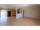 Bright living room open to kitchen area, featuring tile floors and a spacious design at 1811 W Roma Ave, Phoenix, AZ 85015