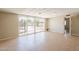 Bright living room with sliding glass doors and tile flooring at 1811 W Roma Ave, Phoenix, AZ 85015