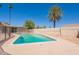 Sparkling swimming pool surrounded by a patio and lush landscaping, creating a private oasis at 1811 W Roma Ave, Phoenix, AZ 85015
