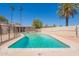 Private pool surrounded by a spacious patio and lush greenery, perfect for outdoor enjoyment at 1811 W Roma Ave, Phoenix, AZ 85015