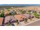 Aerial view of a residential area featuring single-Gathering homes with desert landscaping, driveways, and tile roofs at 1819 W Deer Creek Rd, Phoenix, AZ 85045