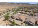 Scenic aerial view of a residential area with single-Gathering homes, desert landscaping, and picturesque mountain views at 1819 W Deer Creek Rd, Phoenix, AZ 85045