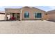 Backyard featuring gravel landscaping, a covered patio, and a privacy wall around the property at 1819 W Deer Creek Rd, Phoenix, AZ 85045
