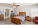 Spacious bedroom boasting plush carpeting, wooden furniture, and serene ambiance for restful nights at 1819 W Deer Creek Rd, Phoenix, AZ 85045