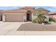 Charming single-story home featuring a desert landscape, neutral stucco, and a two-car garage at 1819 W Deer Creek Rd, Phoenix, AZ 85045