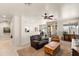 Bright, open-concept living room with easy access to the dining area and outdoor patio at 1819 W Deer Creek Rd, Phoenix, AZ 85045