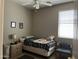 This cozy bedroom features a comfortable twin bed, complemented by a chair and a dresser at 20931 E Desert Hills Blvd, Queen Creek, AZ 85142