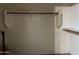 Walk-in closet offering practical storage solutions with shelves and hanging rods; guitar included at 20931 E Desert Hills Blvd, Queen Creek, AZ 85142