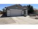 Charming single-story home featuring a two-car garage and well-maintained desert landscaping at 20931 E Desert Hills Blvd, Queen Creek, AZ 85142