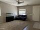Cozy living room featuring neutral carpet and a ceiling fan, offering a relaxing space at 20931 E Desert Hills Blvd, Queen Creek, AZ 85142