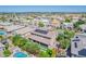 Aerial view of the property with a rooftop solar panel array and a backyard pool at 2219 E Galileo Dr, Gilbert, AZ 85298