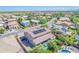 Aerial view of a home with a solar panel array and an inviting pool in a well-manicured backyard at 2219 E Galileo Dr, Gilbert, AZ 85298
