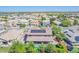 Aerial view of the property with a rooftop solar panel array and a backyard pool at 2219 E Galileo Dr, Gilbert, AZ 85298