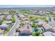 Aerial view of a home with a solar panel array and an inviting pool in a well-manicured backyard at 2219 E Galileo Dr, Gilbert, AZ 85298