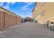 Spacious backyard showing a block fence and patio with paving stones at 2219 E Galileo Dr, Gilbert, AZ 85298