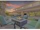 Relaxing backyard with a fire pit, lounge seating, and a private pool at 2219 E Galileo Dr, Gilbert, AZ 85298