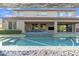 Large backyard featuring a beautiful pool, outdoor seating, and nice architecture at 2219 E Galileo Dr, Gilbert, AZ 85298