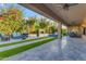 Inviting outdoor living space with a covered patio, comfortable seating, and lush landscaping at 2219 E Galileo Dr, Gilbert, AZ 85298