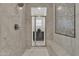 Beautiful tiled shower with glass door, rainfall shower head, bench seating, and mosaic tile wall at 2219 E Galileo Dr, Gilbert, AZ 85298