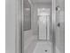 Modern bathroom featuring a glass enclosed shower with marble tiling and mosaic accent wall at 2219 E Galileo Dr, Gilbert, AZ 85298
