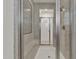 Luxury shower room with marble tiles, glass door, built-in bench and a mosaic tile accent wall at 2219 E Galileo Dr, Gilbert, AZ 85298