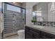 Elegant bathroom showcasing a glass-enclosed shower and dual sink vanity with marble countertop at 2219 E Galileo Dr, Gilbert, AZ 85298