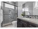 Stylish bathroom with a tiled shower, glass door, modern fixtures, and views of the vanity at 2219 E Galileo Dr, Gilbert, AZ 85298