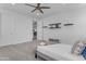 Bright and airy bedroom with neutral walls, carpeting, ceiling fan and modern decor at 2219 E Galileo Dr, Gilbert, AZ 85298