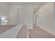 Bright bedroom featuring a comfortable bed, carpet, and a white door at 2219 E Galileo Dr, Gilbert, AZ 85298