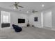 Cozy bonus room with entertainment center, and ample room for children to play at 2219 E Galileo Dr, Gilbert, AZ 85298