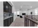 Open concept bonus room boasts built-in cabinets, beverage center, and ample space for seating at 2219 E Galileo Dr, Gilbert, AZ 85298