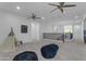Spacious bonus room features multiple ceiling fans, ample seating, and plenty of natural light at 2219 E Galileo Dr, Gilbert, AZ 85298