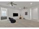 Bright bonus room featuring ceiling fans, flat screen tv and comfortable beanbag seating at 2219 E Galileo Dr, Gilbert, AZ 85298