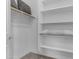 Walk-in closet offering ample shelving and organization options at 2219 E Galileo Dr, Gilbert, AZ 85298