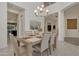 Elegant dining room featuring tile floors, neutral decor, and access to other areas of the home at 2219 E Galileo Dr, Gilbert, AZ 85298