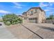 Stately home with a three-car garage, manicured landscaping, and a spacious driveway for ample parking at 2219 E Galileo Dr, Gilbert, AZ 85298