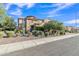 Attractive home with stone facade, landscaped front yard, and well-maintained curb appeal at 2219 E Galileo Dr, Gilbert, AZ 85298
