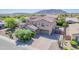 Beautiful two-story home featuring a paver driveway, a three-car garage, and a tile roof at 2219 E Galileo Dr, Gilbert, AZ 85298