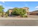 Charming two-story home featuring a stone facade and mature landscaping at 2219 E Galileo Dr, Gilbert, AZ 85298