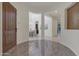 Elegant foyer with decorative tile flooring, arched entryways, and views of the dining and living spaces creates an inviting ambiance at 2219 E Galileo Dr, Gilbert, AZ 85298