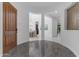 Stunning foyer with decorative tile, arched openings showcasing the dining area and interior spaces at 2219 E Galileo Dr, Gilbert, AZ 85298