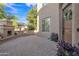 Charming courtyard with a decorative wooden door, fireplace, and seating area offers a relaxing outdoor space at 2219 E Galileo Dr, Gilbert, AZ 85298