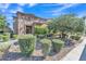 Charming home exterior with stone accents, a tiled roof, and meticulously landscaped front yard at 2219 E Galileo Dr, Gilbert, AZ 85298