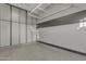Organized garage space with custom cabinets and overhead storage at 2219 E Galileo Dr, Gilbert, AZ 85298