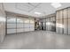 Spacious three car garage features epoxy floors, tons of storage, and pristine lighting at 2219 E Galileo Dr, Gilbert, AZ 85298