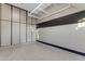 Well-organized garage with custom wall cabinets, epoxy floor, and overhead storage rack at 2219 E Galileo Dr, Gilbert, AZ 85298