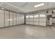 Well-organized garage with epoxy floors and storage cabinets at 2219 E Galileo Dr, Gilbert, AZ 85298